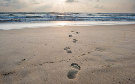 Footsteps On Sandy Beach